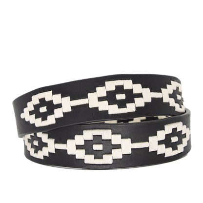 A black leather belt with a white woven geometric pattern and solid brass buckle.