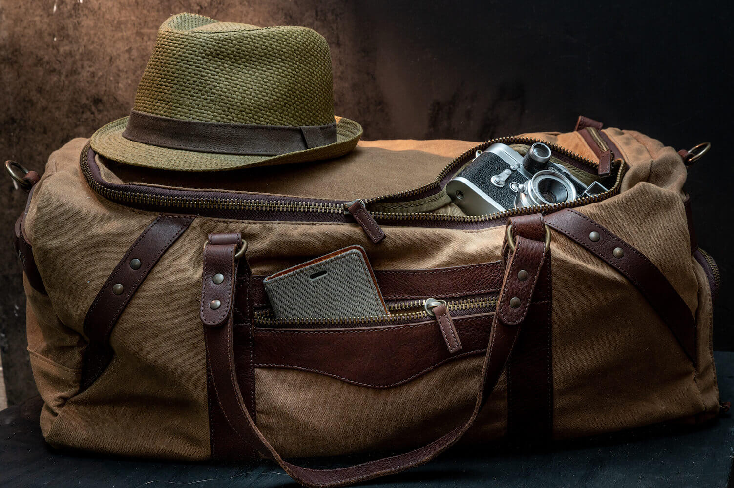 canvas travel duffel bags Medium Heritage Commuter Grey / Brow This 60L canvas duffle expands to 26 Petal Canvas Duffle Bag |